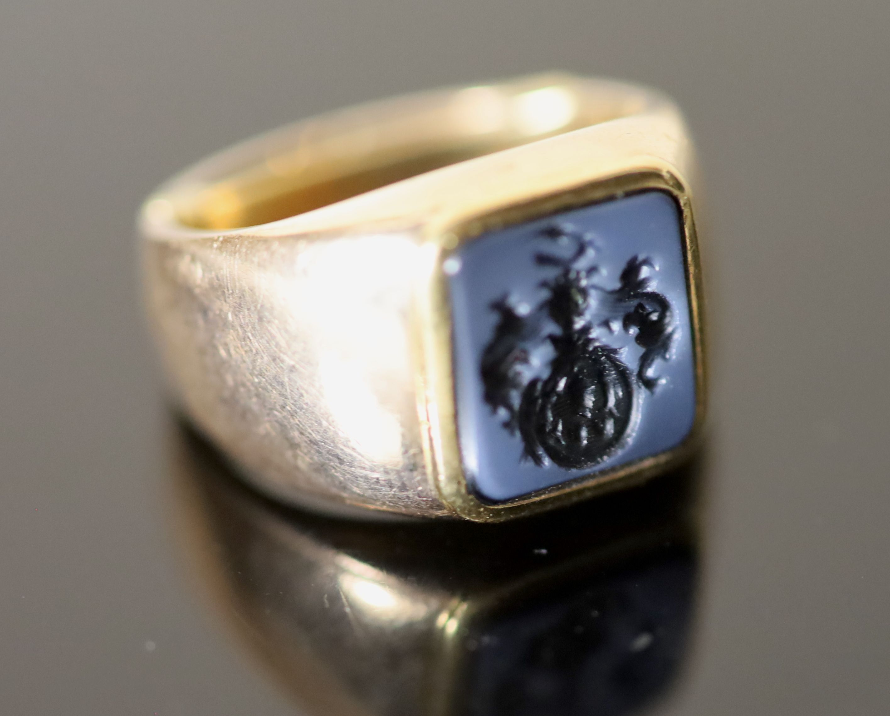 An early 20th century Austro-Hungarian? gold and blue sardonyx set signet ring,